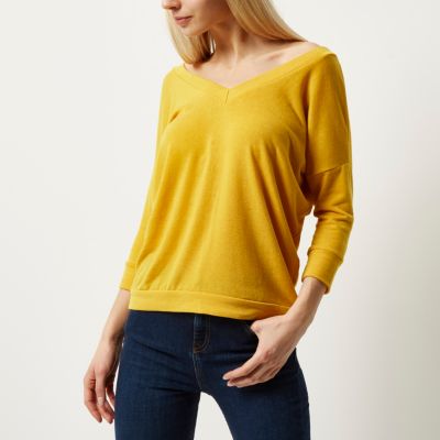 Yellow knitted V-neck cross back jumper